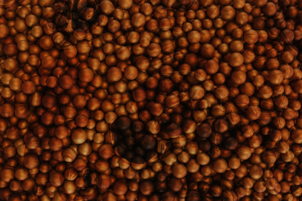 Why Our AHA Exfoliant Uses Natural Beads, Not Plastic — and Why It Matters for Your Skin